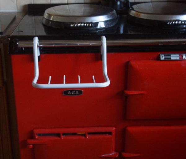 Tea Towel Holder in light grey, on an AGA range cooker